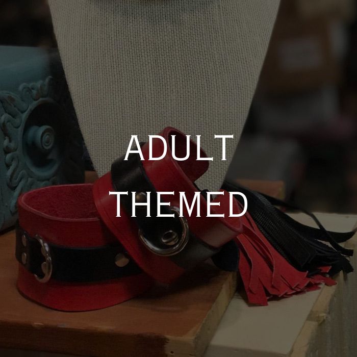 Red and black leather cuffs with tassels gallery link.